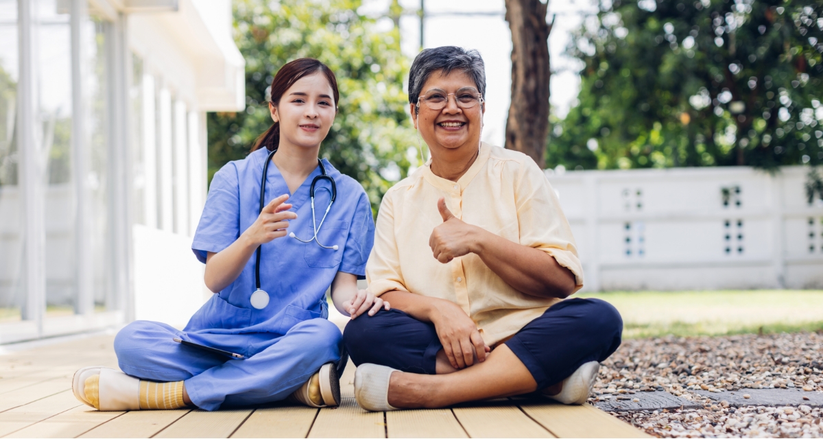 Carer and patient both enjoying the garden