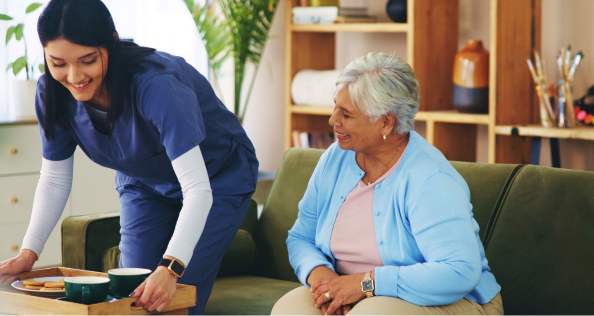 A carer and and elderly female within a domiciliary care setting