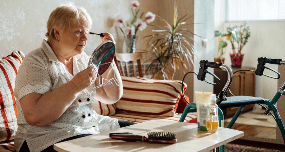 An individual applying make up