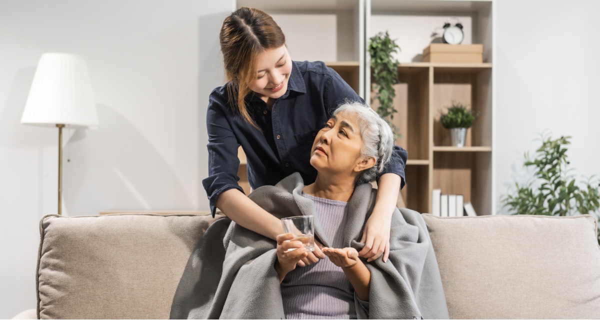 A carer with her elderly patient
