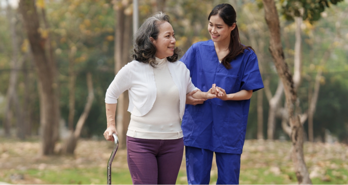 Older person with her carer